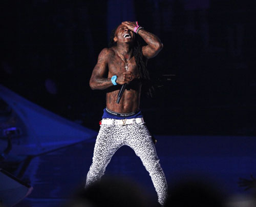 This picture of Lil Wayne performing at the recent MTV Awards tells me a few